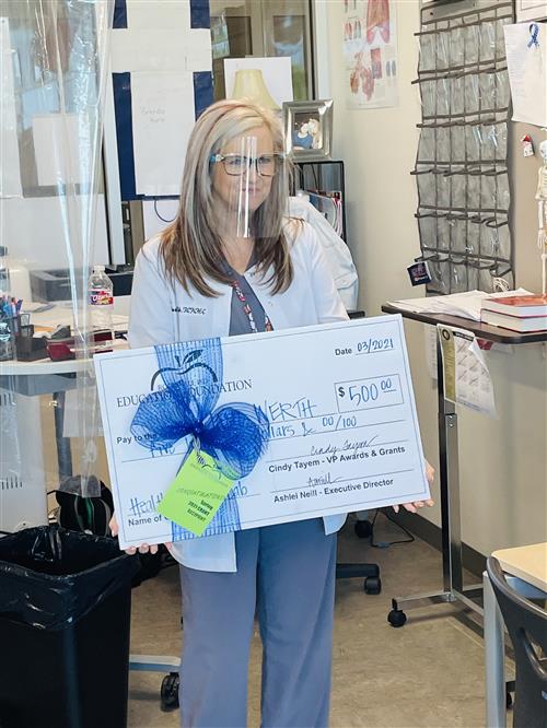 Rockwall ISD Education Foundation Donates Money for New EKG Machine at Burton Academy 
